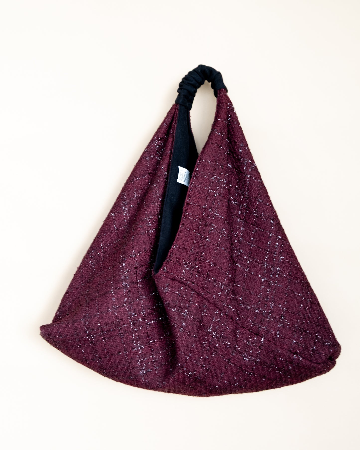 Borsa reversibile Claudine in lamè burgundy e lana, vista frontale